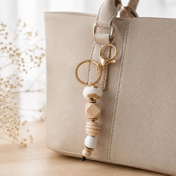 Porte clé de sac or et blanc